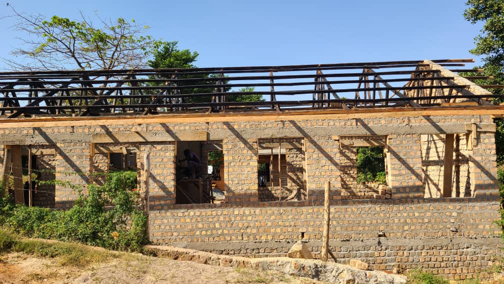 Brick structure and roof framing under construction